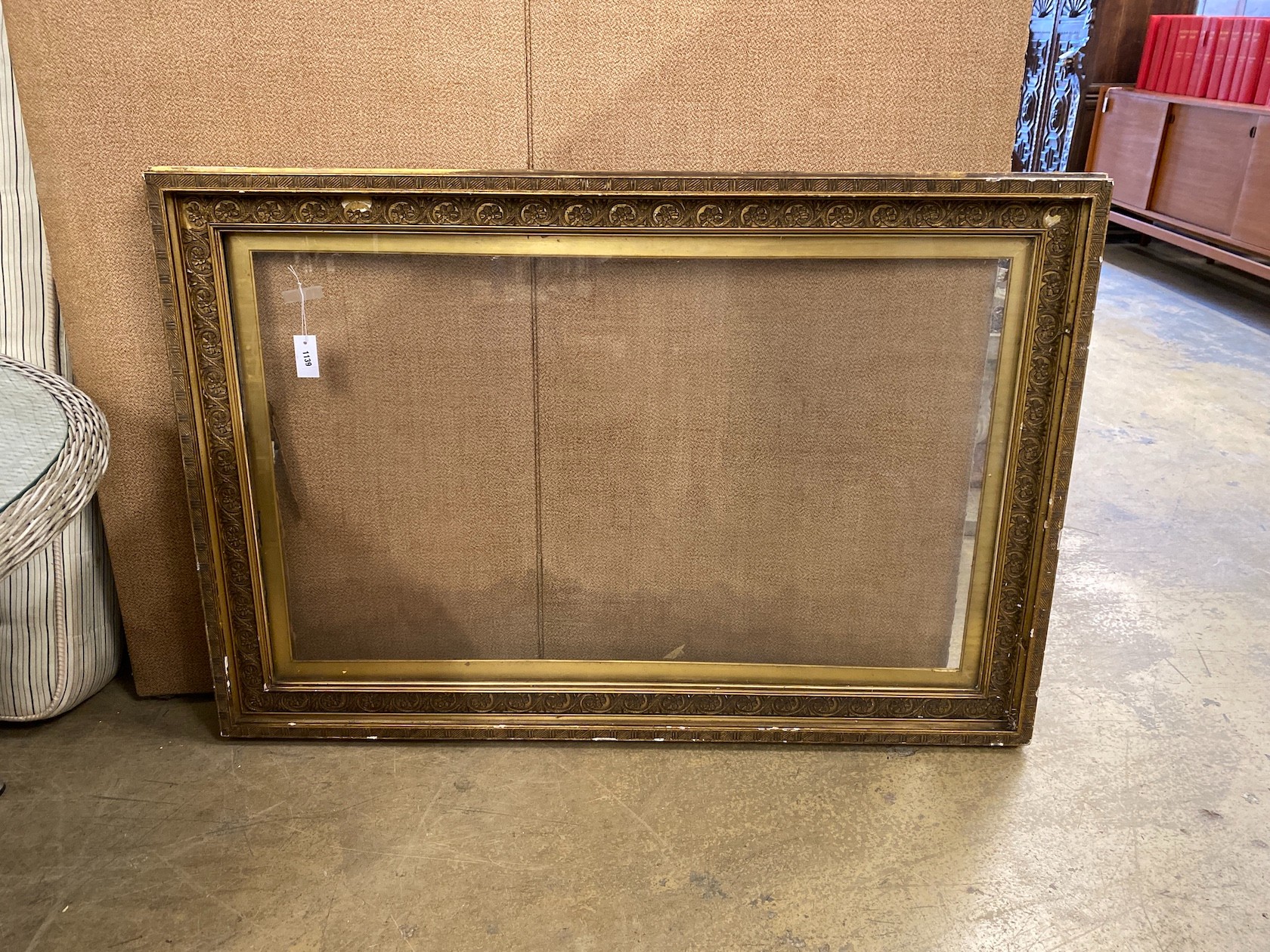 A Victorian rectangular giltwood and gesso picture frame, width 147cm, height 99cm (aperture width 128cm, height 80cm)